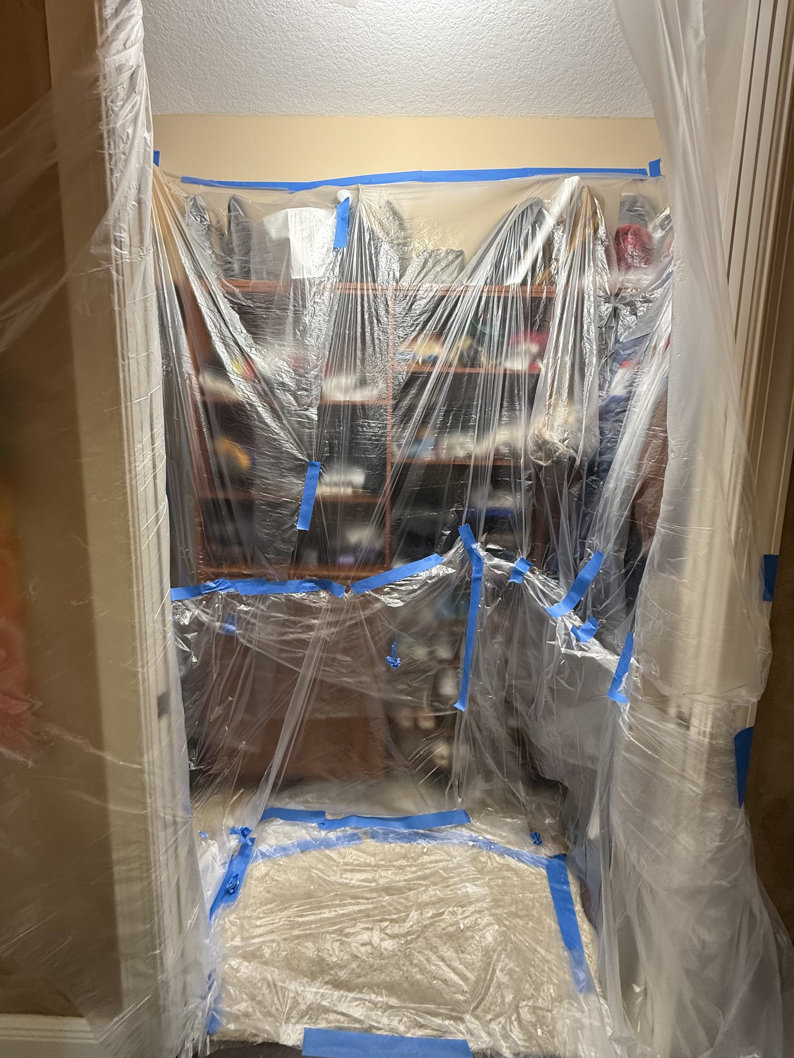 Full dust containment protecting homeowner belongings during interior repair, Irvine, CA